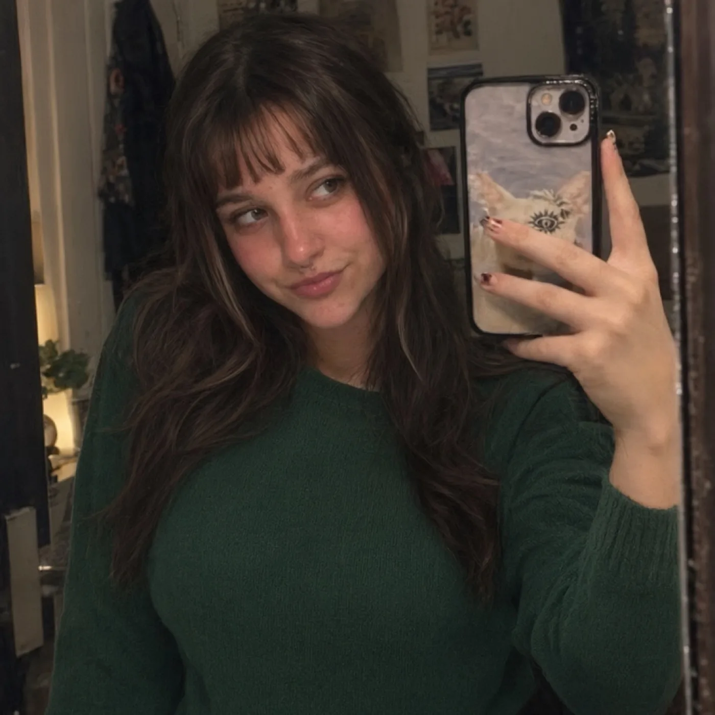 Portrait with a black graphic shirt changed to a forest-green sweater